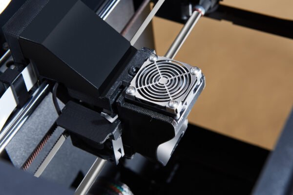 Compact Tiertime UP Mini 3D Printer, ideal for home use, printing intricate designs with ease